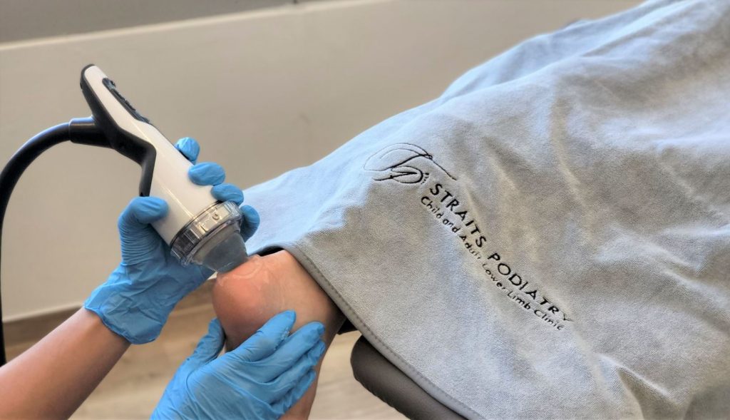 podiatrist performing Achilles Tendonitis treatment