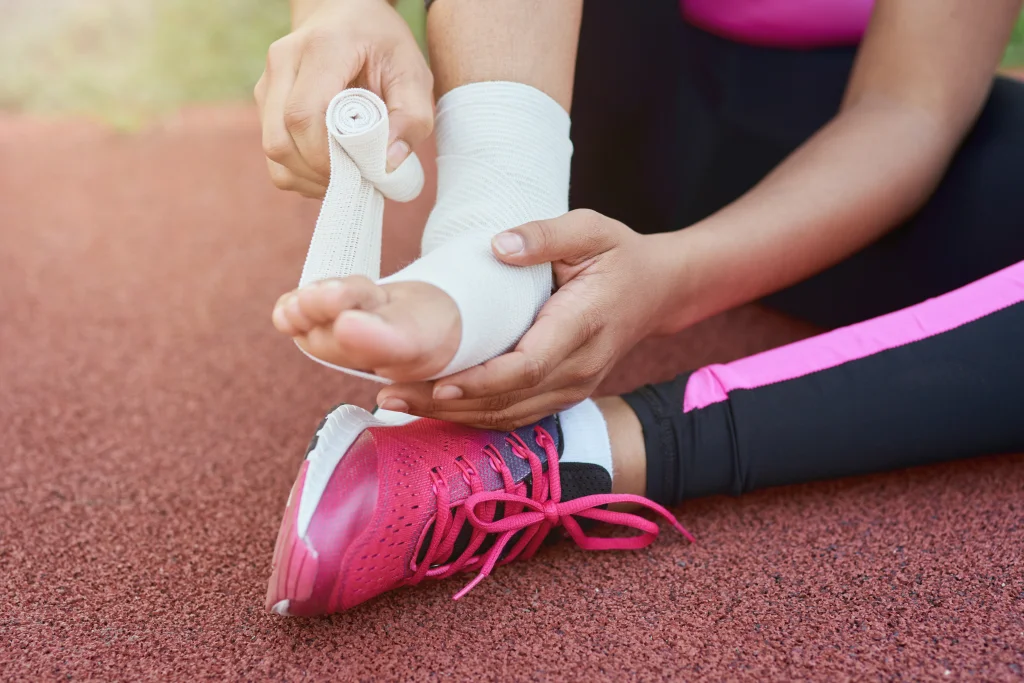 Podiatrist assessing the foot and lower limb to identify factors contributing to Ankle Impingement