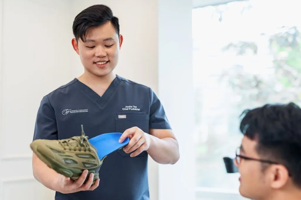 podiatrist explaining custom insoles