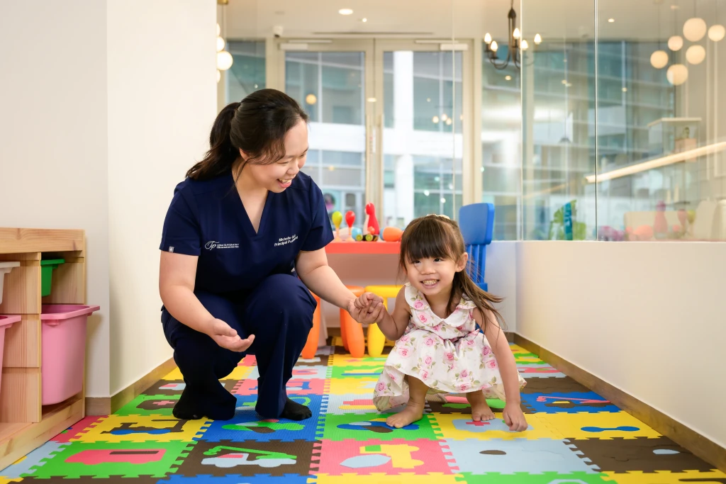 Podiatrist at Straits Podiatry assessing and treating Sever's Disease in Singapore