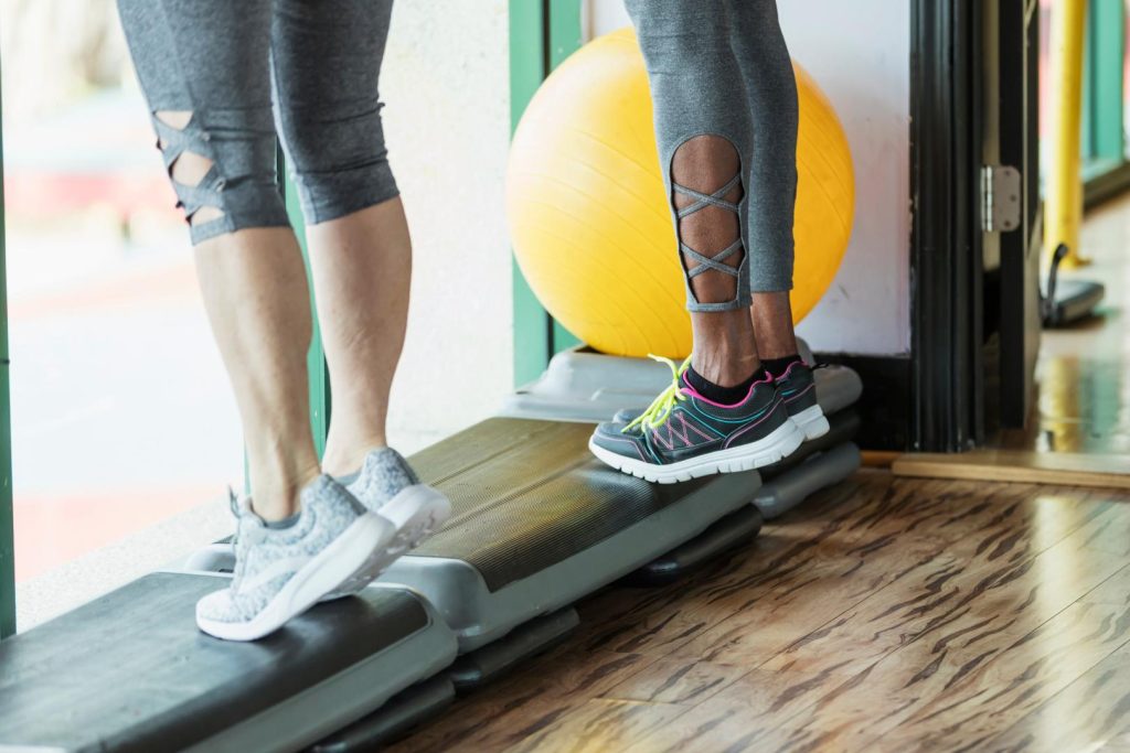 Plantar fasciitis exercises. Straits Podiatry in Singapore. A photo showing patients performing exercises to manage their plantar fasciitis symptoms.