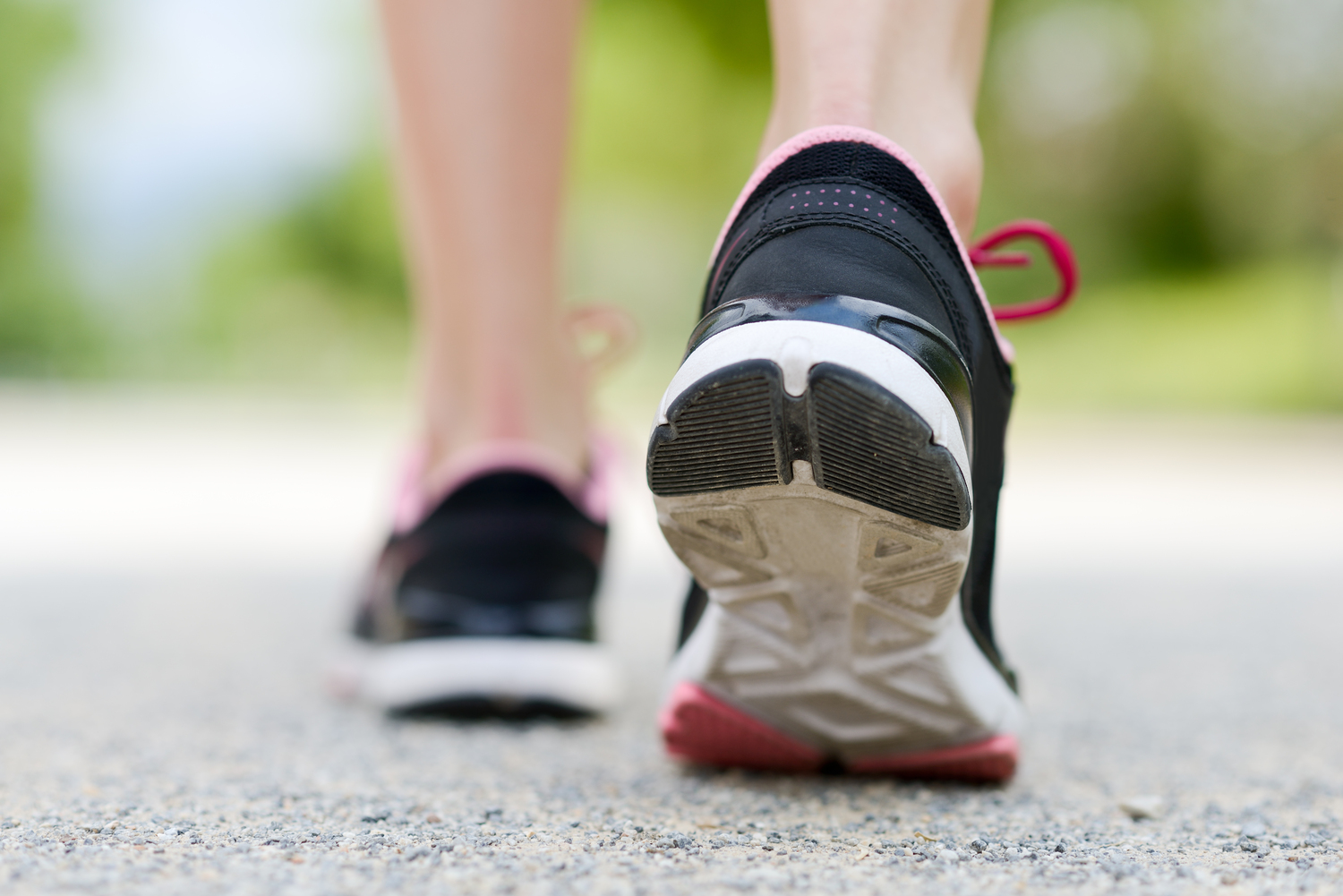 woman running in sports shoes for plantar fasciitis