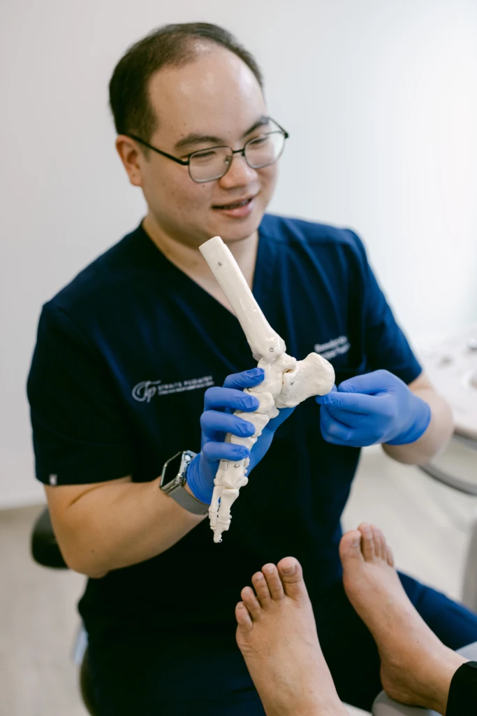 Podiatrist at Straits Podiatry assessing and treating Accessory Navicular Syndrome in Singapore