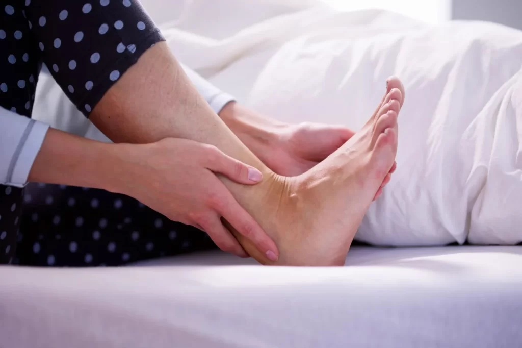 Lady suffering morning heel pain after getting out of bed