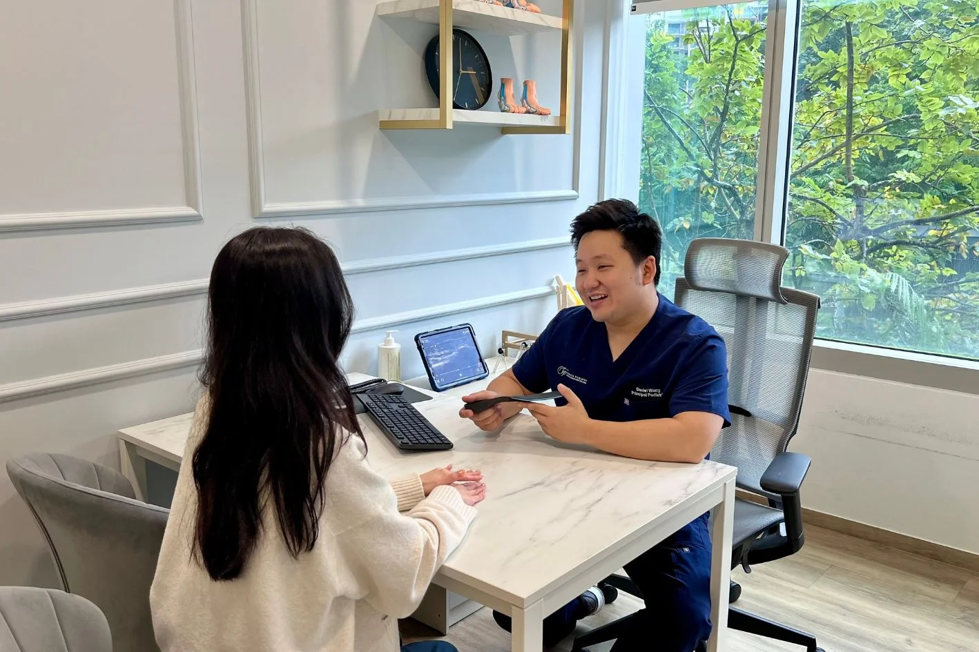 Podiatrist consulting a patient in Singapore