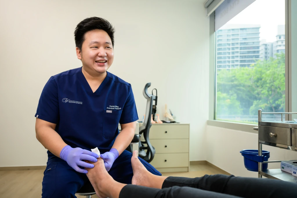 Podiatrist at Straits Podiatry assessing and treating Paronychia in Singapore