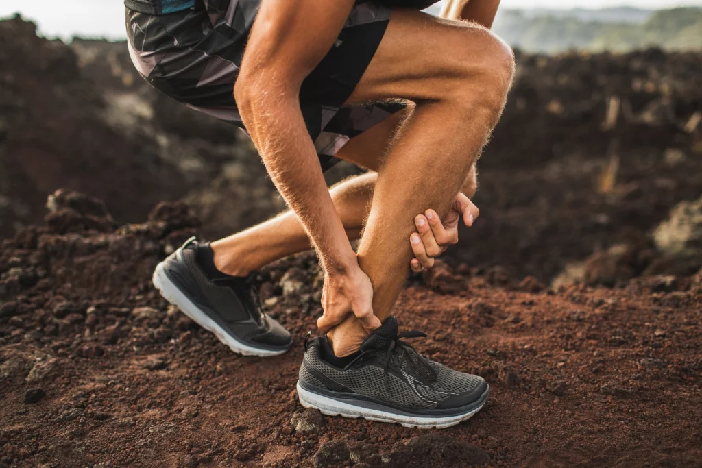 Podiatrist assessing the foot and lower limb to identify factors contributing to Peroneal Tendonitis