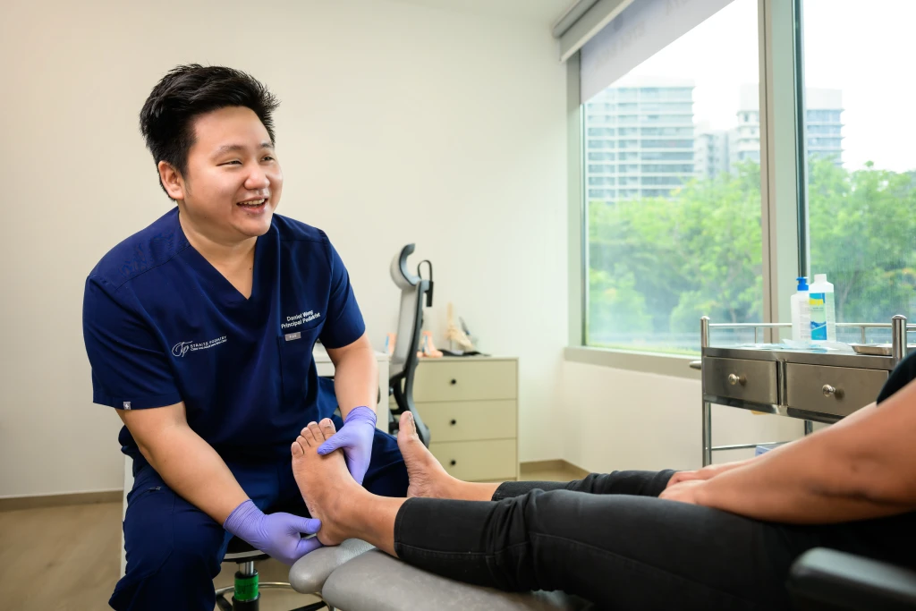 Podiatrist at Straits Podiatry assessing and treating Peroneal Tendonitis in Singapore