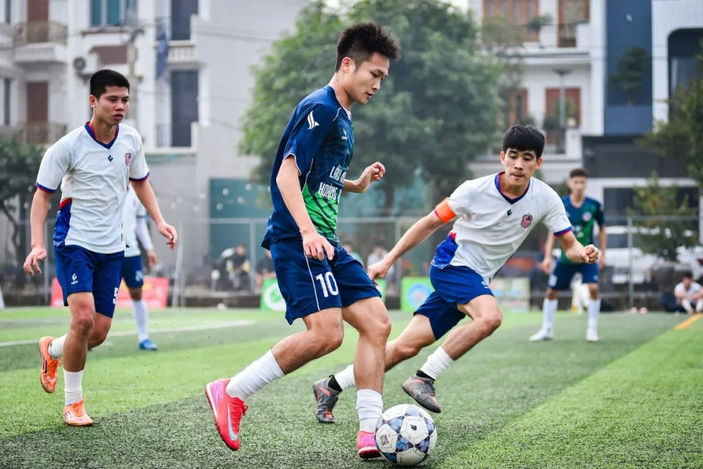 Group of players playing football