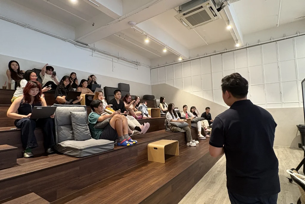 A Straits Podiatry podiatrist giving a foot-health education talk to a seated audience.