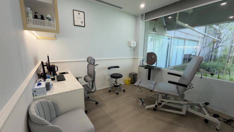 A consultation room with a treatment chair and clinician desk at the Straits Podiatry Orchard clinic.