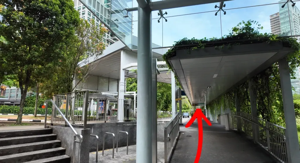 Leave the station and continue along the sheltered covered walkway.