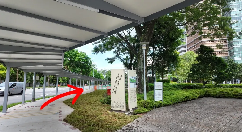 Follow the covered walkway past the "one-north Park: Rochester East" sign.
