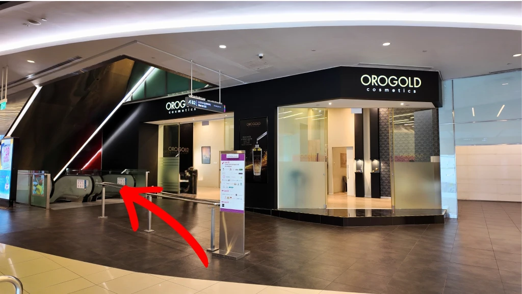 At Orchard Gateway, take the escalator down to B2 towards the underpass.