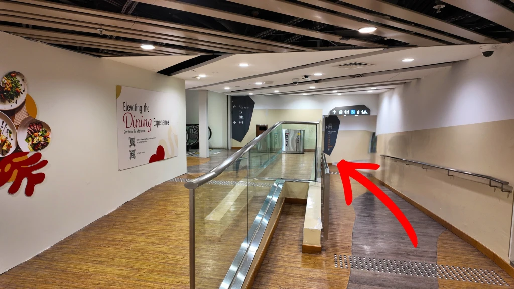 Walk down the ramp and take the lift up to Level 6.