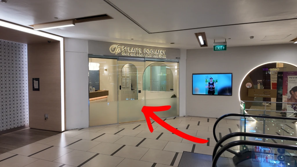 Straits Podiatry (#02-01) is directly ahead as you step off the escalator.